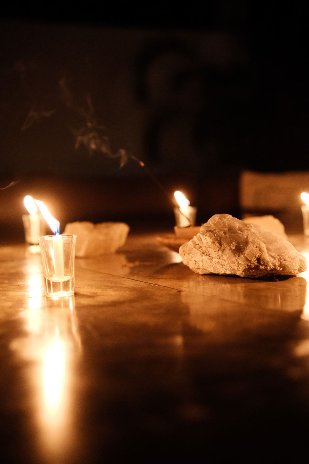 Candles and a crystal on a polished floor